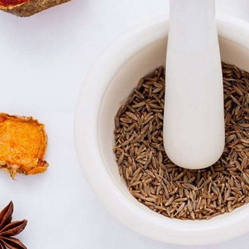 Natural ED treatments, mortar and pestle surrounded by herbs and spices | e-Surgery