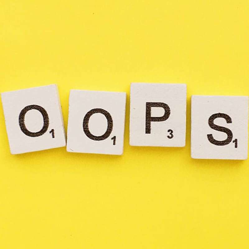 Oops! We Made a Mistake… scrabble letters spelling oops on a yellow background | e-Surgery