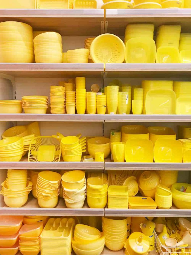 Yellow Tupperware on shelving