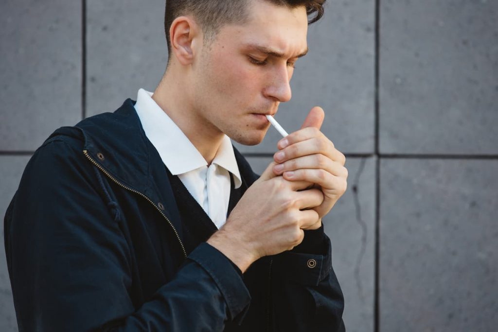 Man smoking cigarette | Does Smoking Cause Erectile Dysfunction? How Quitting Can Help Your Sex Life! | e-Surgery