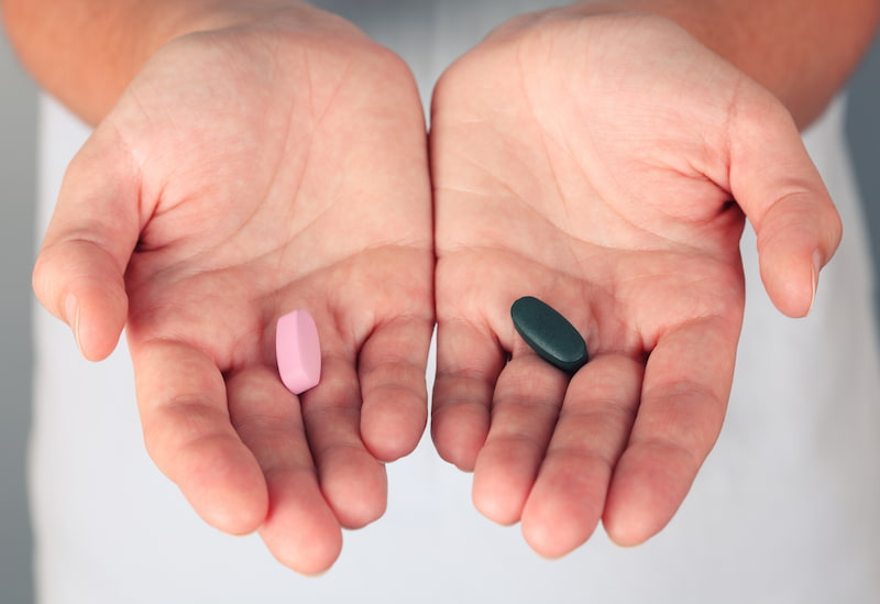 man deciding the difference between Omeprazole and Lansoprazole