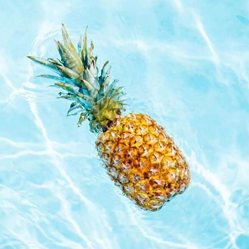 Pineapple floating in water, stay healthy this summer, e-Surgery