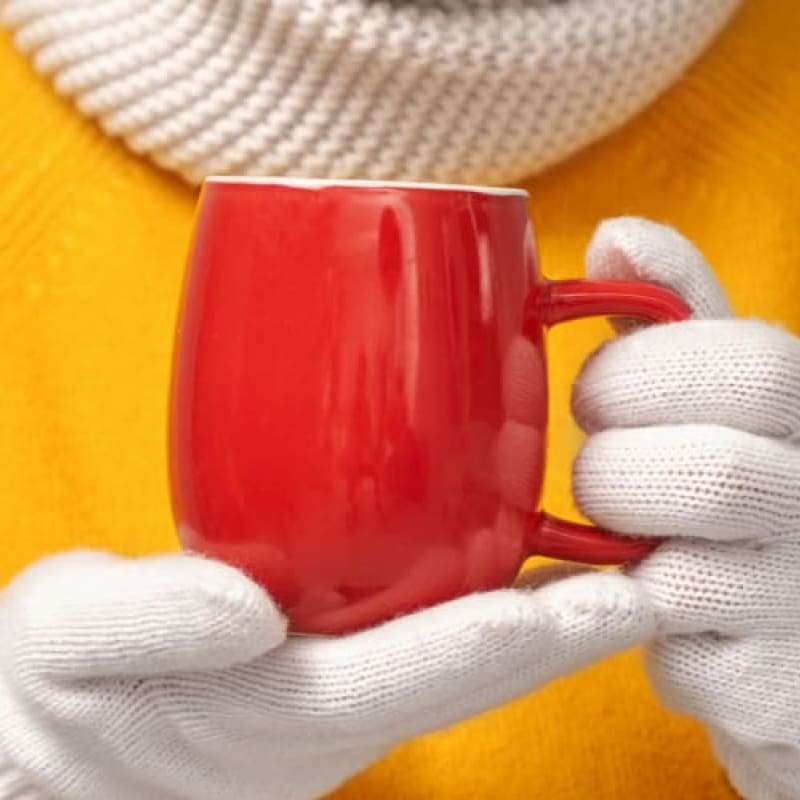 Lady holding mug as cold weather affecting blood pressure