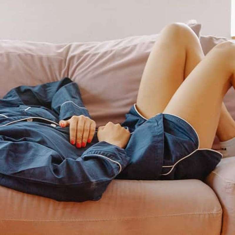 Woman unwell in bed with UTI pain at night