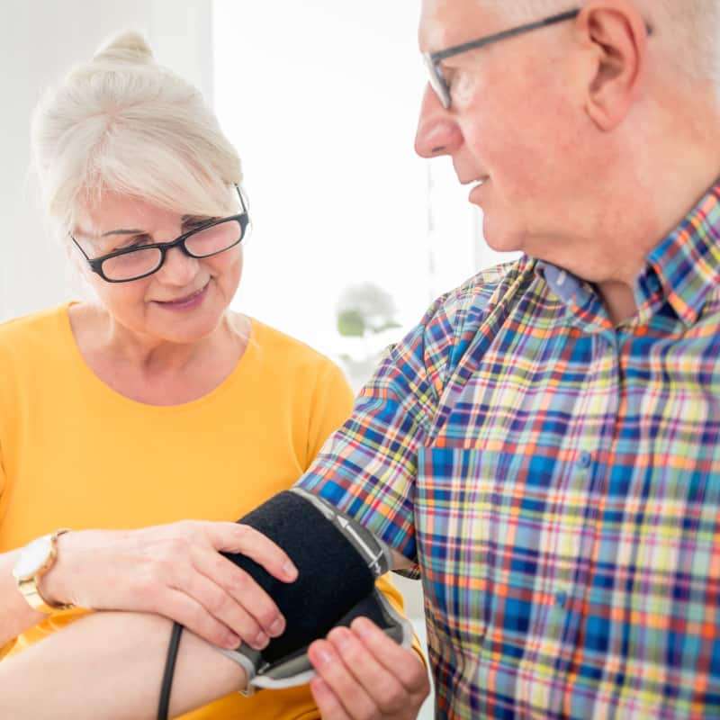 What is Atenolol? Elderly woman taking and elderly mans blood pressure
