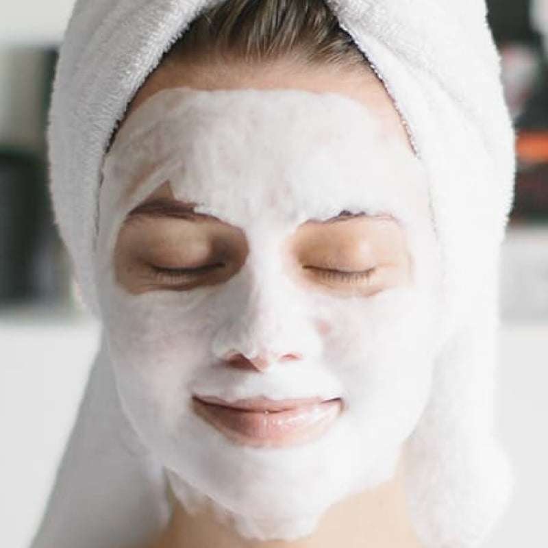 Acne in lockdown, woman with facemask and head towel, e-Surgery
