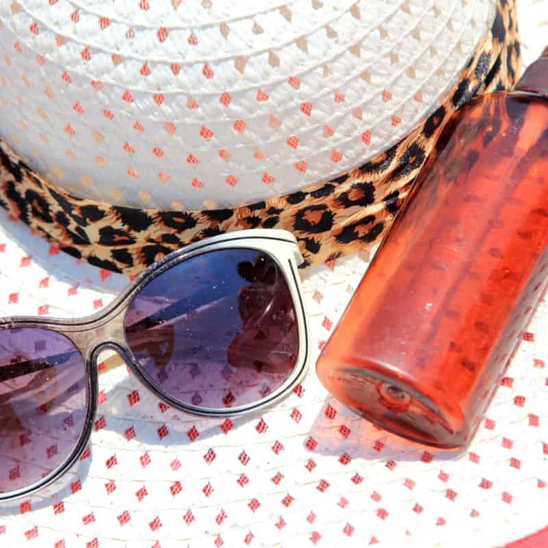 do sun block pills really work? sun glasses, hat and oil on a beach | e-Surgery