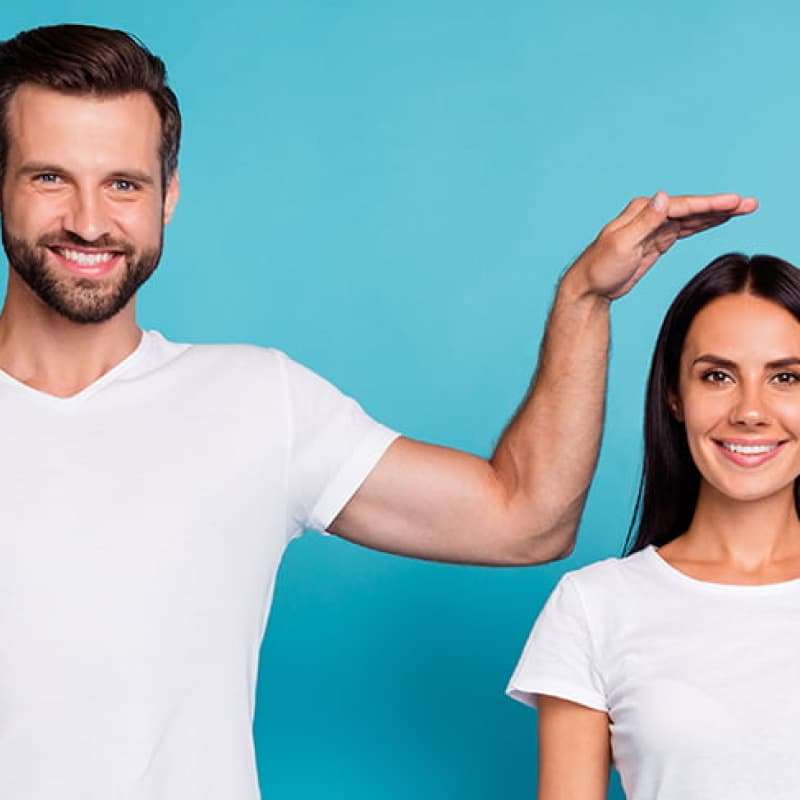 Short and tall people in white shirt and blue jeans, why being tall is good for you health, e-Surgery