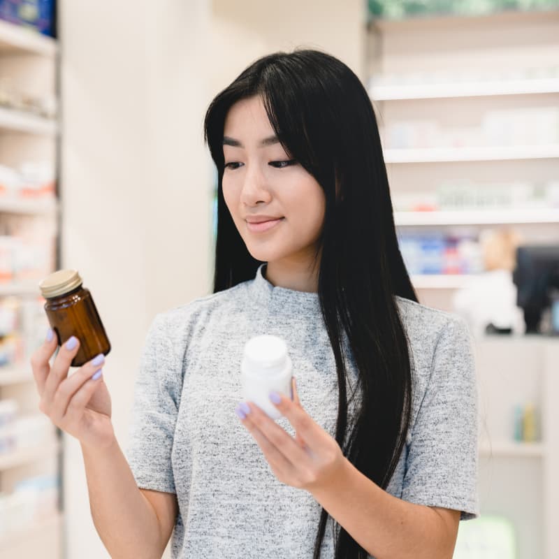woman examining which is better Nitrofurantoin vs Trimethoprim | e-surgery