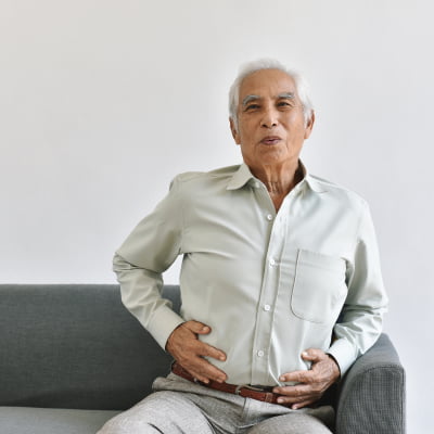 man suffering from acid reflux, are there any Omeprazole Side Effects | e-surgery