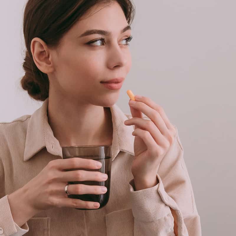 Women Taking Antibiotic | e-Surgery Article